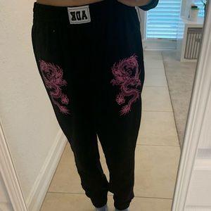 Adika sweatpants with pink dragon symbol 🐉